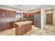 Kitchen featuring custom wood cabinetry, stainless steel appliances, and a center island at 28758 N Ashbrook Ln, San Tan Valley, AZ 85144