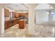 Well-equipped kitchen boasting wood cabinets, an island, and stainless steel appliances at 28758 N Ashbrook Ln, San Tan Valley, AZ 85144