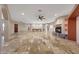 Large living room showcases fireplace and arched doorways at 28758 N Ashbrook Ln, San Tan Valley, AZ 85144