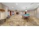 Open-concept living room with fireplace and access to the kitchen at 28758 N Ashbrook Ln, San Tan Valley, AZ 85144