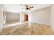 Large main bedroom boasting travertine floors, a ceiling fan, and neutral wall colors at 28758 N Ashbrook Ln, San Tan Valley, AZ 85144