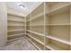 Spacious pantry featuring an abundance of shelving for optimal storage and organization at 28758 N Ashbrook Ln, San Tan Valley, AZ 85144