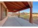 View of the backyard from the covered patio with ceiling fans at 28758 N Ashbrook Ln, San Tan Valley, AZ 85144