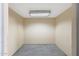 A clean storage room with a concrete floor and a fluorescent ceiling light provides ample space at 28758 N Ashbrook Ln, San Tan Valley, AZ 85144