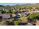 Aerial view of a desert community with single Gathering homes near mountains at 3055 N Red Mtn # 122, Mesa, AZ 85207