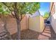 The backyard features desert landscaping with gravel, storage shed and privacy fence at 3055 N Red Mtn # 122, Mesa, AZ 85207