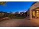 Home featuring brick patio and manicured landscaping with privacy fence at 3055 N Red Mtn # 122, Mesa, AZ 85207