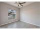 Bedroom with wood-look floors and a picture window with neighborhood views at 3055 N Red Mtn # 122, Mesa, AZ 85207