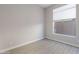 Neutral bedroom with wood-look floors and a sunny window with a shade at 3055 N Red Mtn # 122, Mesa, AZ 85207