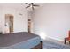 Light and airy bedroom featuring wood-look floors and access to the bathroom and closet at 3055 N Red Mtn # 122, Mesa, AZ 85207