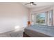 Relaxing bedroom filled with natural light and a sliding glass door overlooking the backyard at 3055 N Red Mtn # 122, Mesa, AZ 85207
