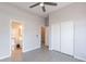 Neutral bedroom with wood-look floors and access to the closet and bathroom at 3055 N Red Mtn # 122, Mesa, AZ 85207
