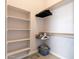 Walk-in closet featuring ample shelving and hanging storage for optimal organization at 3055 N Red Mtn # 122, Mesa, AZ 85207