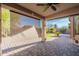 Inviting covered patio offering desert landscaping and an expansive backyard at 3055 N Red Mtn # 122, Mesa, AZ 85207