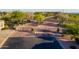 Decorative metal gate at the entrance of a community with desert landscaping at 3055 N Red Mtn # 122, Mesa, AZ 85207