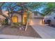Charming single-story home featuring desert landscaping and a two-car garage at 3055 N Red Mtn # 122, Mesa, AZ 85207