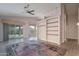 Living room with vaulted ceilings, ceiling fan and ceramic tile floors and built-in shelving at 3055 N Red Mtn # 122, Mesa, AZ 85207