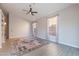 Living room with vaulted ceilings, ceiling fan and ceramic tile floors at 3055 N Red Mtn # 122, Mesa, AZ 85207