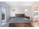 Serene main bedroom with natural light, a wooden bed frame, and stylish, matching nightstands at 3055 N Red Mtn # 122, Mesa, AZ 85207