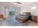 Spacious main bedroom featuring a large window, vaulted ceilings, and stylish furnishings at 3055 N Red Mtn # 122, Mesa, AZ 85207