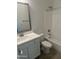 A bright bathroom features a shower and tub combination with a white vanity and framed mirror at 3637 E Rochelle Cir, Mesa, AZ 85213