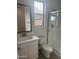 A bright bathroom features a walk-in shower, white vanity, framed mirror, and window for natural light at 3637 E Rochelle Cir, Mesa, AZ 85213