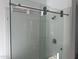 Modern bathroom featuring a frameless glass shower with sleek hardware and neutral tile at 3637 E Rochelle Cir, Mesa, AZ 85213