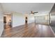 Upstairs landing with wood-look flooring and views from windows, offering a great bonus room space at 41143 W Rio Bravo Dr, Maricopa, AZ 85138