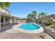 Inviting backyard pool area surrounded by desert landscaping and a covered patio, perfect for relaxation at 41143 W Rio Bravo Dr, Maricopa, AZ 85138