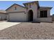 Inviting single-story home featuring desert landscaping, a two-car garage, and a covered entryway at 4117 W Allen St, Laveen, AZ 85339