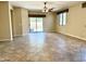 Spacious living room featuring tile floors and a sliding glass door leading to the backyard at 4117 W Allen St, Laveen, AZ 85339
