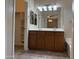 Main bath with dual sinks, ample lighting, and walk-in closet at 4117 W Allen St, Laveen, AZ 85339