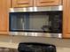 Modern stainless steel microwave above a black range at 4117 W Allen St, Laveen, AZ 85339