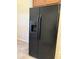 Modern black refrigerator with water and ice dispenser at 4117 W Allen St, Laveen, AZ 85339