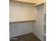 Organized walk-in closet with shelving and ample storage space in the main bedroom at 4117 W Allen St, Laveen, AZ 85339