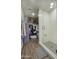 This walk-in closet/bathroom features a glass shower with white subway tile and wood-look flooring at 475 N 9Th St # 303, Phoenix, AZ 85006