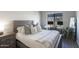 Cozy bedroom featuring a large window with city view, a desk and a modern design at 475 N 9Th St # 303, Phoenix, AZ 85006