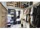 Walk-in closet features custom wood shelving and organizers, offering ample storage space at 475 N 9Th St # 303, Phoenix, AZ 85006