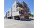 Modern multi-story building featuring balconies, red brick accents, and convenient parking at 475 N 9Th St # 303, Phoenix, AZ 85006