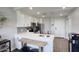 Modern kitchen with white cabinets, stainless steel appliances, and eat-in bar at 475 N 9Th St # 303, Phoenix, AZ 85006