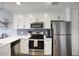 Bright kitchen with white cabinets, stainless steel appliances, and subway tile backsplash at 475 N 9Th St # 303, Phoenix, AZ 85006
