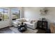 Bright living room featuring a comfortable white sectional sofa and a large window at 475 N 9Th St # 303, Phoenix, AZ 85006
