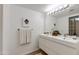 Modern bathroom with double sink vanity, large mirror, and stylish lighting at 4932 E Kathleen Rd, Scottsdale, AZ 85254
