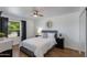 Bedroom with a ceiling fan, window with natural light, and a dresser at 4932 E Kathleen Rd, Scottsdale, AZ 85254