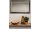 Close-up of console table with mirror and decorative elements in the entryway at 4932 E Kathleen Rd, Scottsdale, AZ 85254
