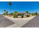 Charming home with mature landscaping, palm trees, and a well-maintained yard at 4932 E Kathleen Rd, Scottsdale, AZ 85254