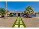 Charming home with manicured desert landscaping and a walkway to the front door at 4932 E Kathleen Rd, Scottsdale, AZ 85254