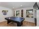 Game room featuring a ping pong table, mounted TV, and bright natural light from the windows at 4932 E Kathleen Rd, Scottsdale, AZ 85254