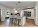 Bright kitchen featuring white cabinets, stainless appliances, granite island, and convenient bar seating at 4932 E Kathleen Rd, Scottsdale, AZ 85254