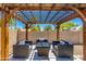 Relaxing pergola with comfortable seating, perfect for enjoying the outdoors at 4932 E Kathleen Rd, Scottsdale, AZ 85254